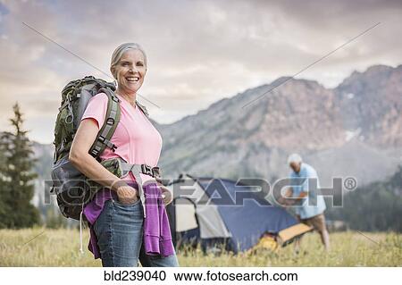Caucasian couple camping on mountain View Large Photo Image Stock Image - Caucasian couple camping on mountain. Fotosearch