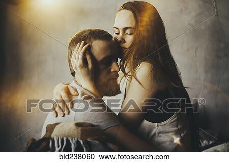 Caucasian couple cuddling View Large Photo Image Stock Image - Caucasian couple cuddling. Fotosearch