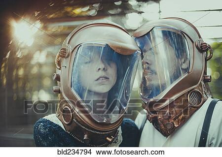 Caucasian couple wearing diving helmets View Large Photo Image Picture - Caucasian couple wearing diving helmets. Fotosearch