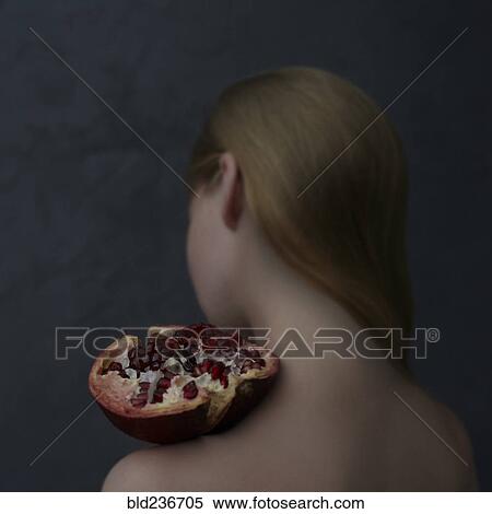 Caucasian girl balancing pomegranate slice on shoulder View Large Photo Image Stock Photography - Caucasian girl balancing pomegranate slice on shoulder. Fotosearch