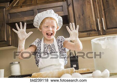 Caucasian girl covered in flour View Large Photo Image Stock Photo - Caucasian girl covered in flour. Fotosearch