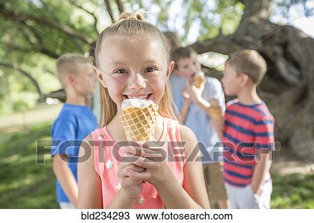 Caucasian girl eating ice cream cone View Large Photo Image Stock Image - Caucasian girl eating ice cream cone. Fotosearch