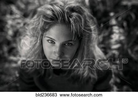 Stock Image - Caucasian girl looking up. Fotosearch