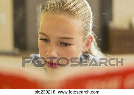 Caucasian girl reading book View Large Photo Image Stock Photo - Caucasian girl reading book. Fotosearch