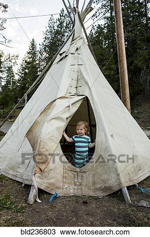 Caucasian girl standing in teepee View Large Photo Image Stock Image - Caucasian girl standing in teepee. Fotosearch
