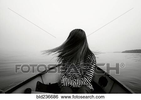 Caucasian girl tossing hair in boat View Large Photo Image Stock Photograph - Caucasian girl tossing hair in boat. Fotosearch