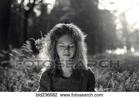 Caucasian girl with eyes closed in field View Large Photo Image Stock Image - Caucasian girl with eyes closed in field. Fotosearch