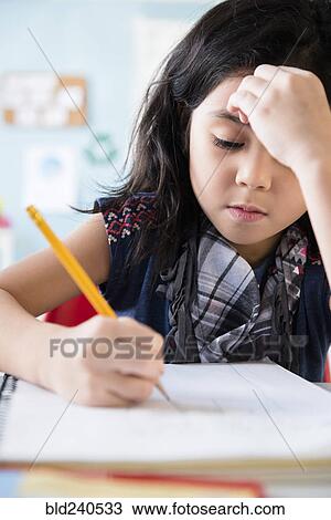 Caucasian girl writing in notebook at school View Large Photo Image Stock Image - Caucasian girl writing in notebook at school. Fotosearch
