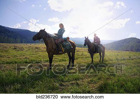 Caucasian girls riding horses in field View Large Photo Image Stock Image - Caucasian girls riding horses in field. Fotosearch