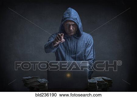 Caucasian hacker stealing money from laptop View Large Photo Image Stock Image - Caucasian hacker stealing money from laptop. Fotosearch