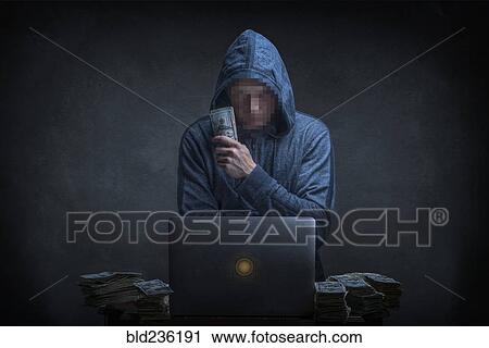 Stock Image - Caucasian hacker stealing money from laptop. Fotosearch