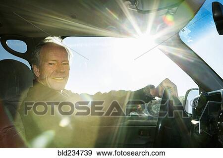 Caucasian man driving car View Large Photo Image Stock Photo - Caucasian man driving car. Fotosearch