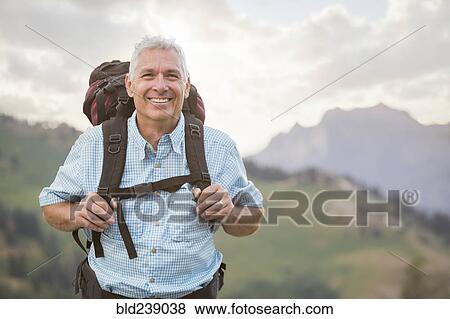 Caucasian man hiking on mountain View Large Photo Image Stock Photo - Caucasian man hiking on mountain. Fotosearch