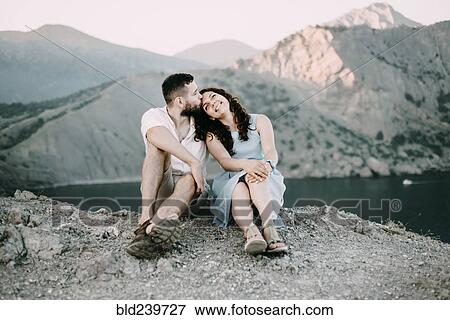 Caucasian man kissing woman on forehead at lake View Large Photo Image Stock Photo - Caucasian man kissing woman on forehead at lake. Fotosearch