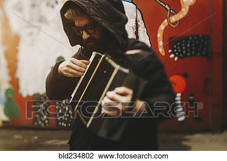 Caucasian man playing accordion View Large Photo Image Stock Image - Caucasian man playing accordion. Fotosearch