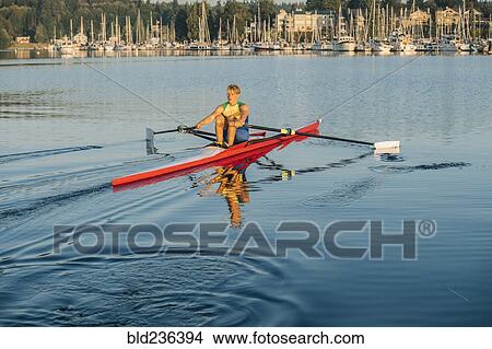 Caucasian man rowing on lake View Large Photo Image Picture - Caucasian man rowing on lake. Fotosearch