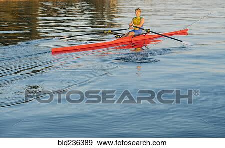 Caucasian man rowing on lake View Large Photo Image Stock Photo - Caucasian man rowing on lake. Fotosearch