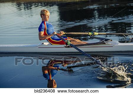Caucasian man rowing on river View Large Photo Image Stock Photo - Caucasian man rowing on river. Fotosearch