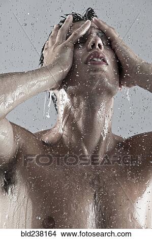 Picture - Caucasian man showering. Fotosearch