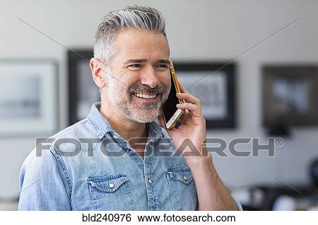 Caucasian man talking on cell phone View Large Photo Image Stock Photograph - Caucasian man talking on cell phone. Fotosearch