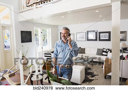 Caucasian man talking on telephone View Large Photo Image Stock Photo - Caucasian man talking on telephone. Fotosearch