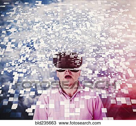 Stock Image - Caucasian man using vr goggles watching floating pixels. Fotosearch