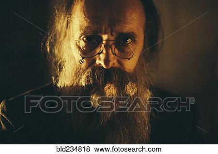 Stock Photo - Caucasian man with beard and eyeglasses. Fotosearch