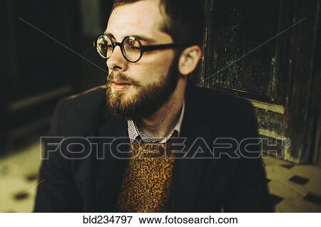 Caucasian man with beard sitting on front stoop View Large Photo Image Stock Photo - Caucasian man with beard sitting on front stoop. Fotosearch