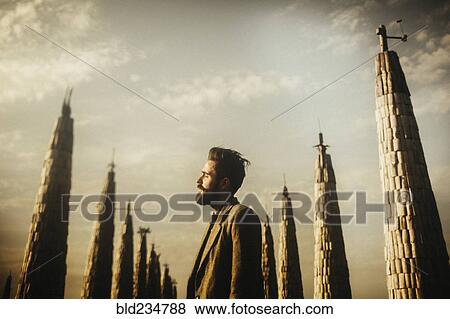 Caucasian man with beard standing near pillars View Large Photo Image Stock Photo - Caucasian man with beard standing near pillars. Fotosearch