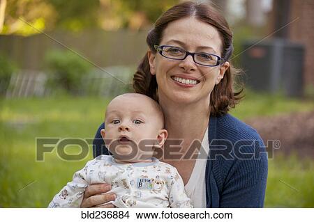 Picture - Caucasian mother posing with baby son. Fotosearch