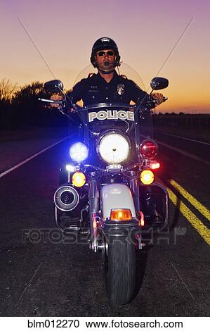 Caucasian policeman riding on motorcycle View Large Photo Image Stock Image - Caucasian policeman riding on motorcycle. Fotosearch