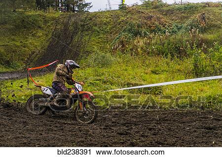 Caucasian racer on motorcycle spraying dirt View Large Photo Image Stock Image - Caucasian racer on motorcycle spraying dirt. Fotosearch