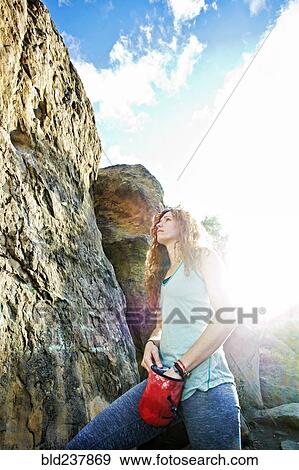 Caucasian woman chalking hands for rock climbing View Large Photo Image Stock Photo - Caucasian woman chalking hands for rock climbing. Fotosearch