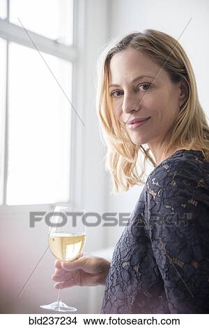 Caucasian woman drinking white wine View Large Photo Image Picture - Caucasian woman drinking white wine. Fotosearch
