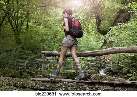 Caucasian woman hiking in forest View Large Photo Image Stock Image - Caucasian woman hiking in forest. Fotosearch