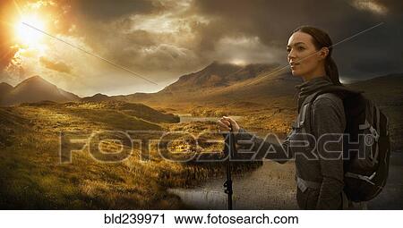Caucasian woman hiking near mountain river at sunset View Large Photo Image Stock Image - Caucasian woman hiking near mountain river at sunset. Fotosearch