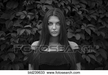 Caucasian woman near foliage View Large Photo Image Stock Image - Caucasian woman near foliage. Fotosearch