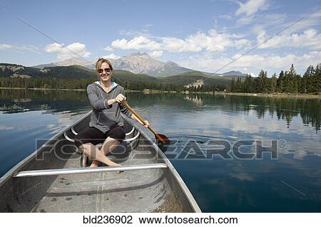 Caucasian woman paddling in kayak View Large Photo Image Stock Image - Caucasian woman paddling in kayak. Fotosearch