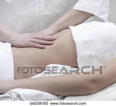 Caucasian woman receiving massage of midsection View Large Photo Image Stock Image - Caucasian woman receiving massage of midsection. Fotosearch