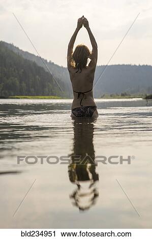 Caucasian woman standing in lake wearing bikini View Large Photo Image Stock Image - Caucasian woman standing in lake wearing bikini. Fotosearch