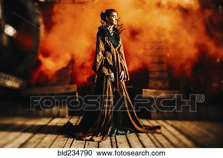 Caucasian woman wearing branch necklace and dress on stage View Large Photo Image Stock Image - Caucasian woman wearing branch necklace and dress on stage. Fotosearch