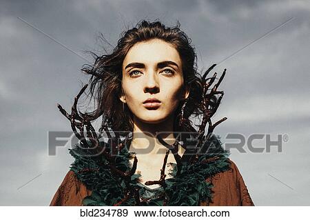 Stock Photo - Caucasian woman wearing branch necklace. Fotosearch