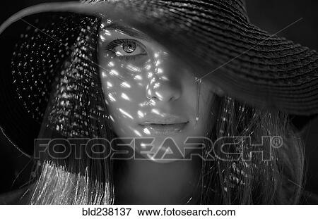 Caucasian woman wearing sun hat View Large Photo Image Stock Photo - Caucasian woman wearing sun hat. Fotosearch