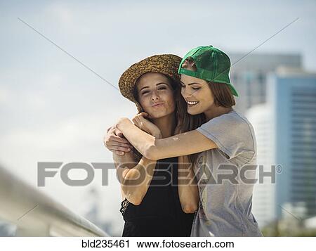 Caucasian women wearing hugging View Large Photo Image Stock Image - Caucasian women wearing hugging. Fotosearch