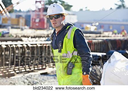 Caucasian worker at construction site View Large Photo Image Stock Image - Caucasian worker at construction site. Fotosearch