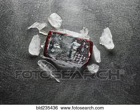 Cell phone frozen in broken ice View Large Photo Image Stock Photograph - Cell phone frozen in broken ice. Fotosearch