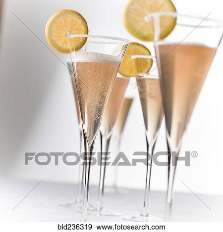 Champagne with lemon slices View Large Photo Image Stock Photo - Champagne with lemon slices. Fotosearch