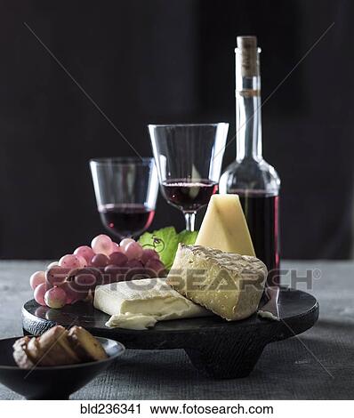 Cheese and grapes with red wine View Large Photo Image Stock Image - Cheese and grapes with red wine. Fotosearch
