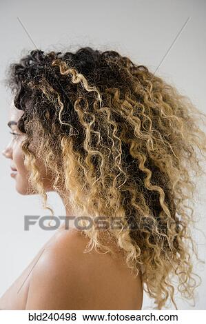 Stock Photo - Close up of Mixed Race woman with bare shoulders. Fotosearch