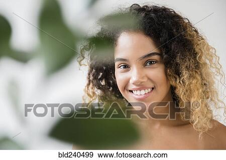 Close up of Mixed Race woman with bare shoulders View Large Photo Image Stock Photo - Close up of Mixed Race woman with bare shoulders. Fotosearch